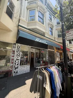 a view of a building with street view and patio