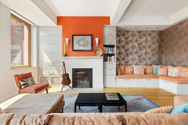 a living room with furniture and a fireplace