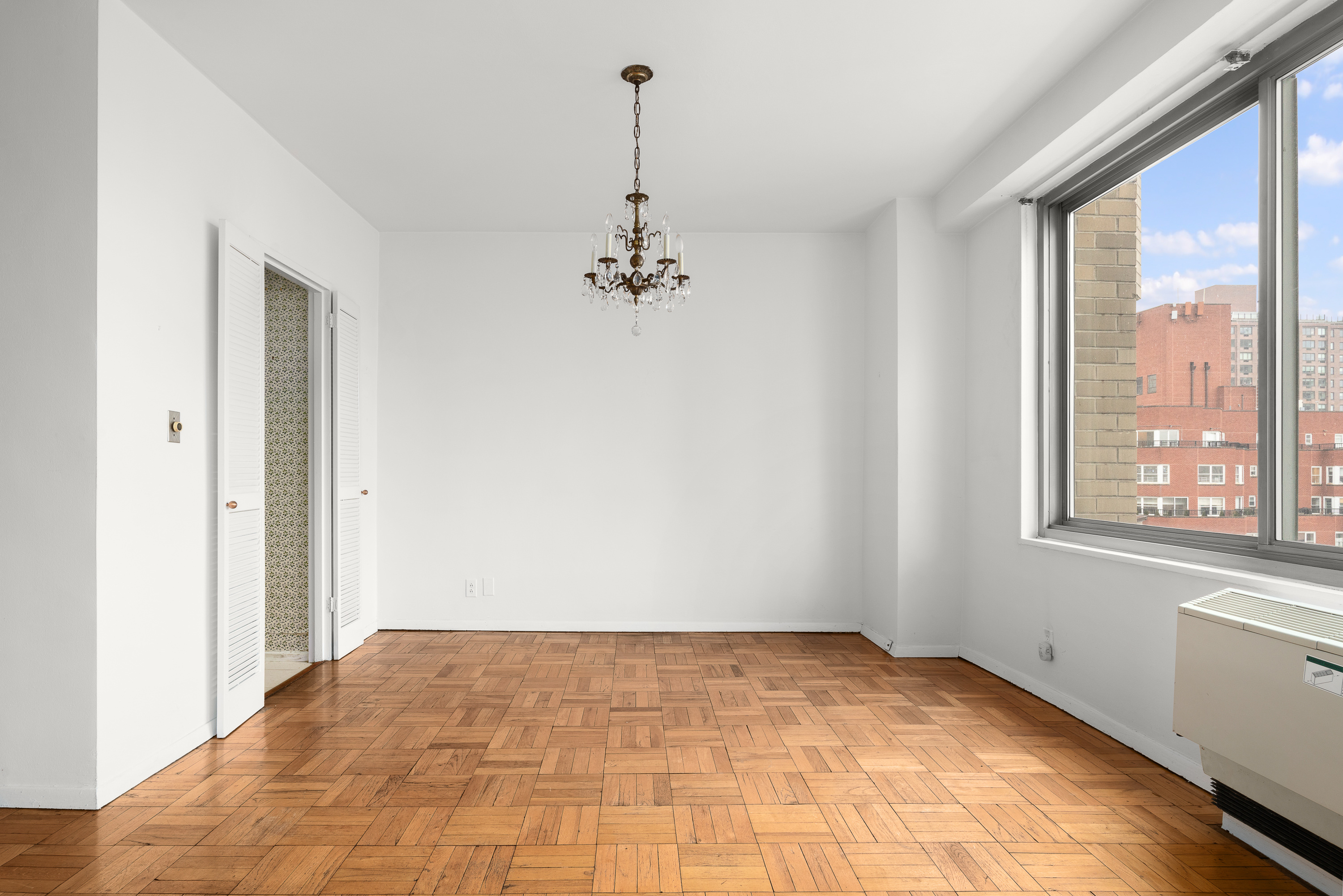 300 East 74th Street, Unit 20E Manhattan, NY 10021 - Photo 2 of 14 a view of a room with a large window