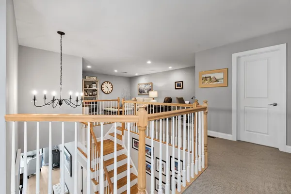 a view of a room with lots of white furniture