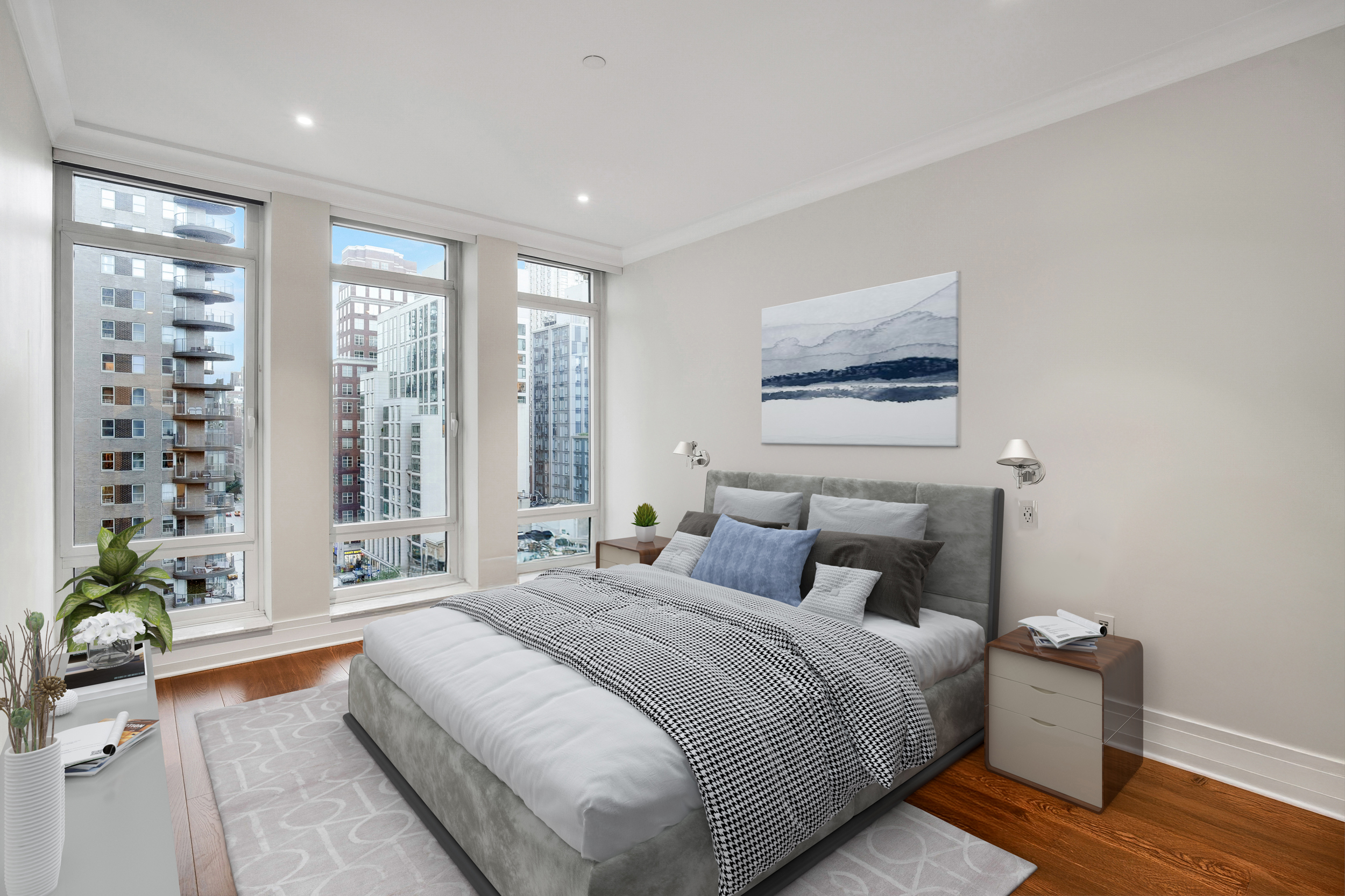 205 East 85th Street, Unit 16H Manhattan, NY 10028 - Photo 8 of 14 a bedroom with a large bed and a potted plant