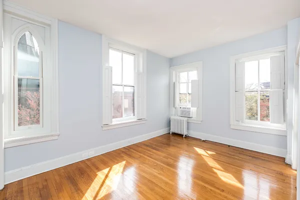 a view of an empty room with a window