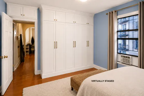 a bedroom with a bed and closet