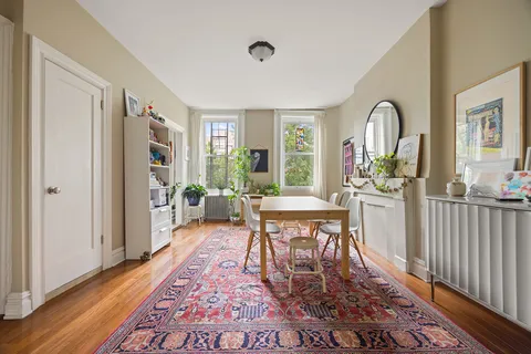 a dining room with furniture window wooden floor