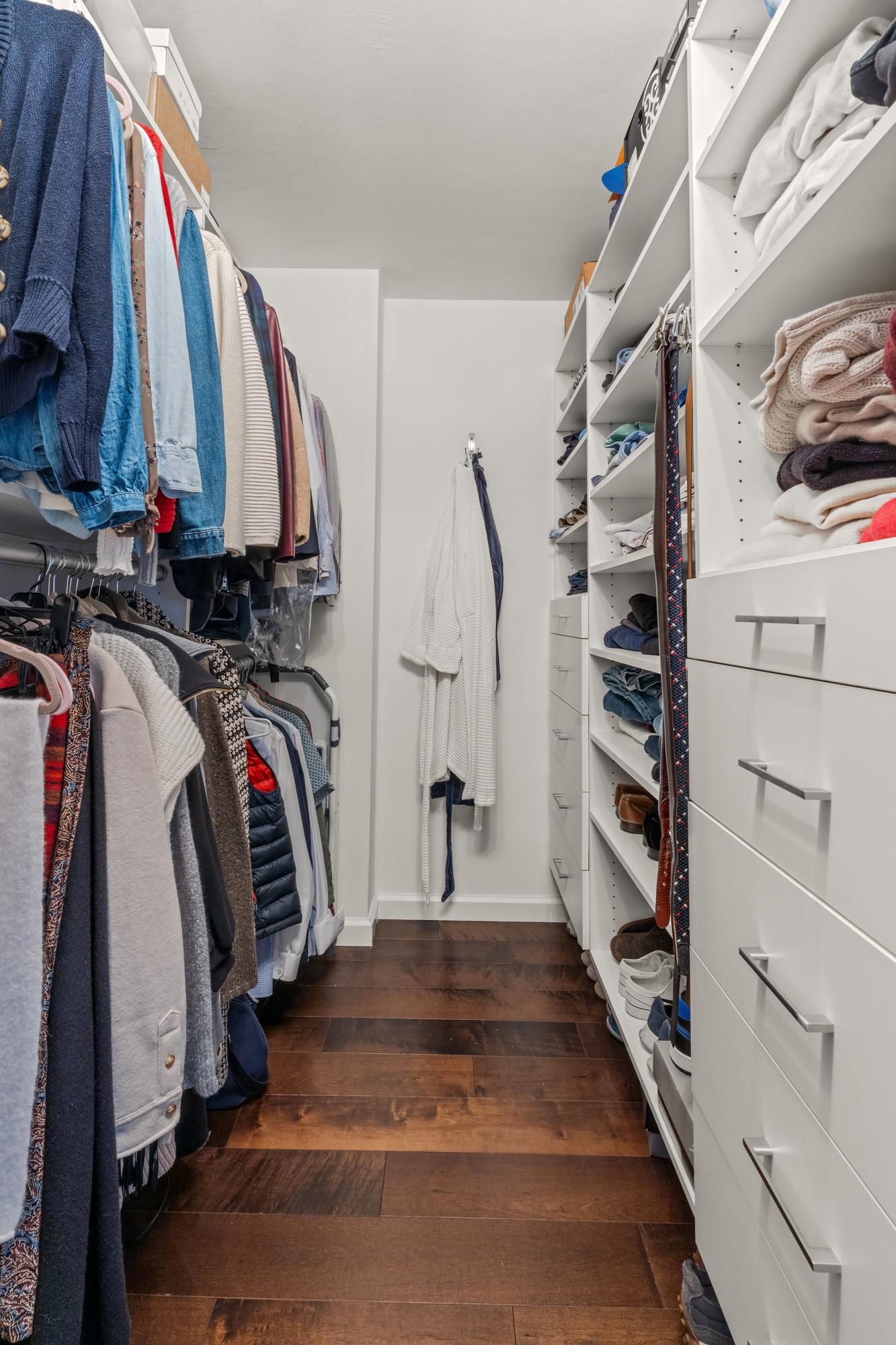 345 East 73rd Street, Unit 11KL Manhattan, NY 10021 - Photo 8 of 12 a view of walk in closet with clothes and shoes