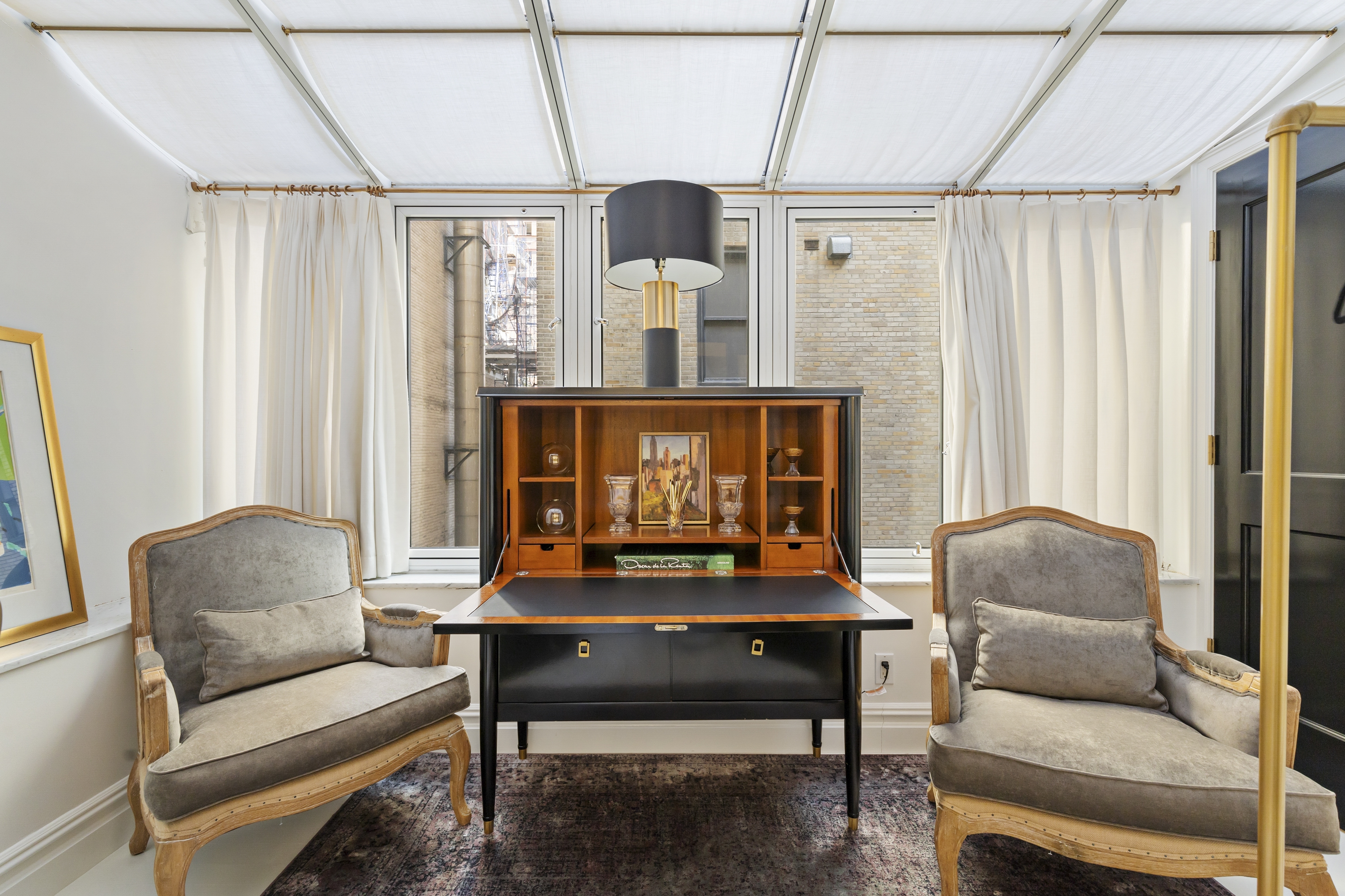 891 Park Avenue, Unit 10 Manhattan, NY 10075 - Photo 19 of 27 a living room with furniture and a window