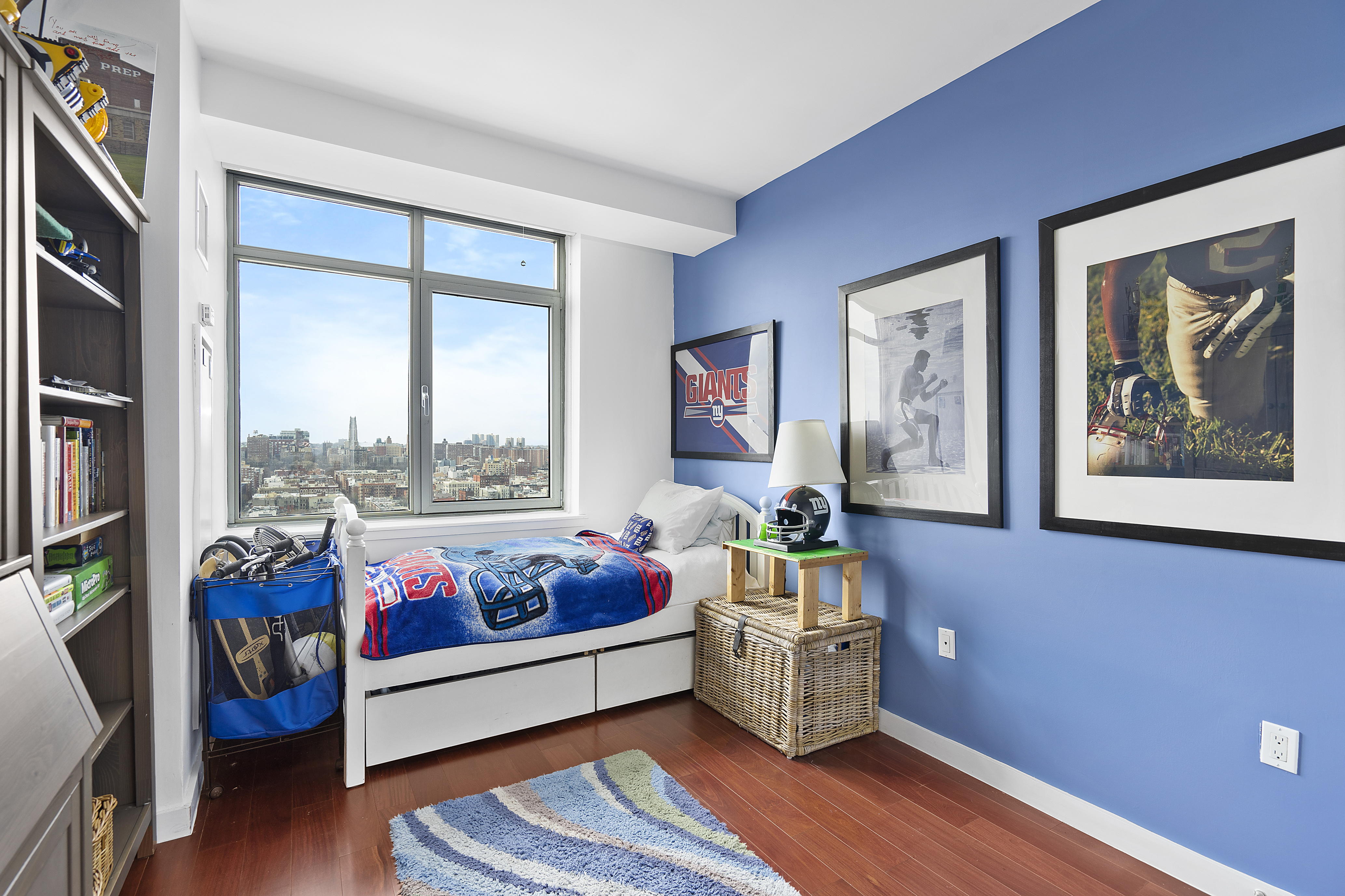 1485 5th Avenue, Unit 18/19H Manhattan, NY 10035 - Photo 11 of 21 a living room with furniture and a window