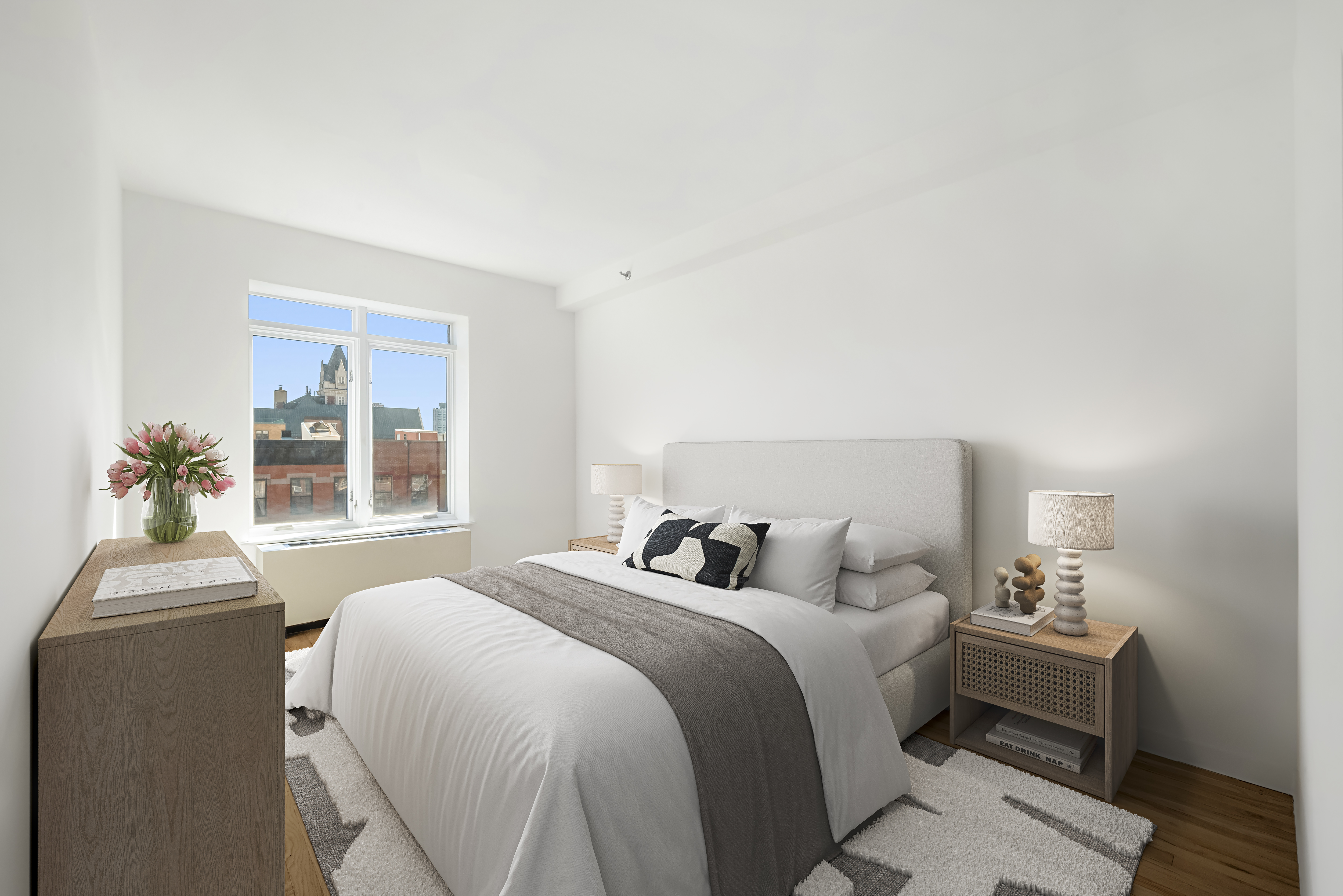 304 West 115th Street, Unit 6A Manhattan, NY 10026 - Photo 7 of 14 a bedroom with a bed and a couch