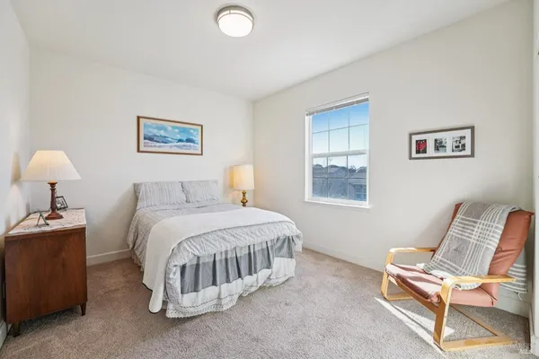 a bedroom with a bed and a closet