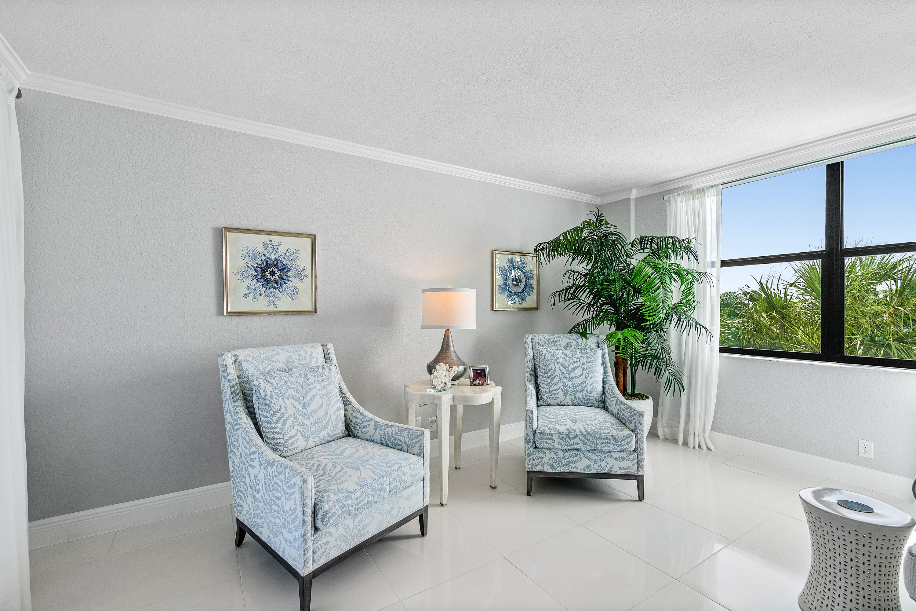 2003 North Ocean Boulevard, Unit 305 Boca Raton, FL 33431 - Photo 8 of 56 a living room with furniture and a potted plant
