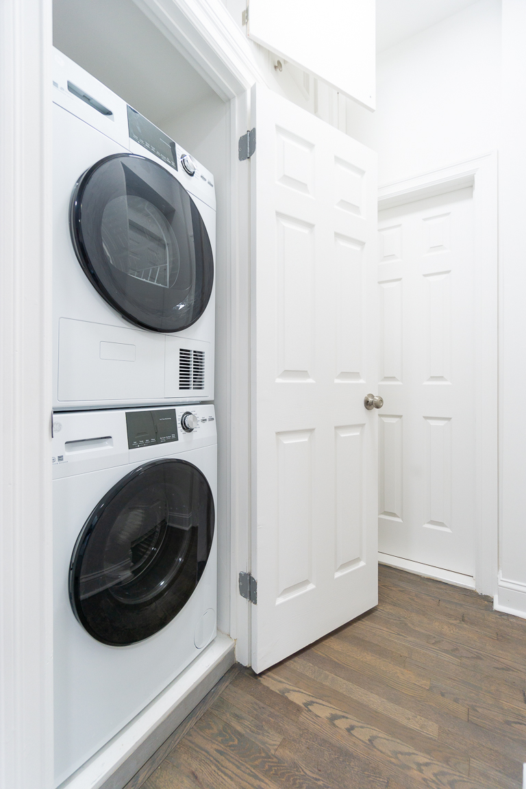 51 East 2nd Street, Unit 2 Manhattan, NY 10003 - Photo 9 of 18 a utility room with dryer and washer