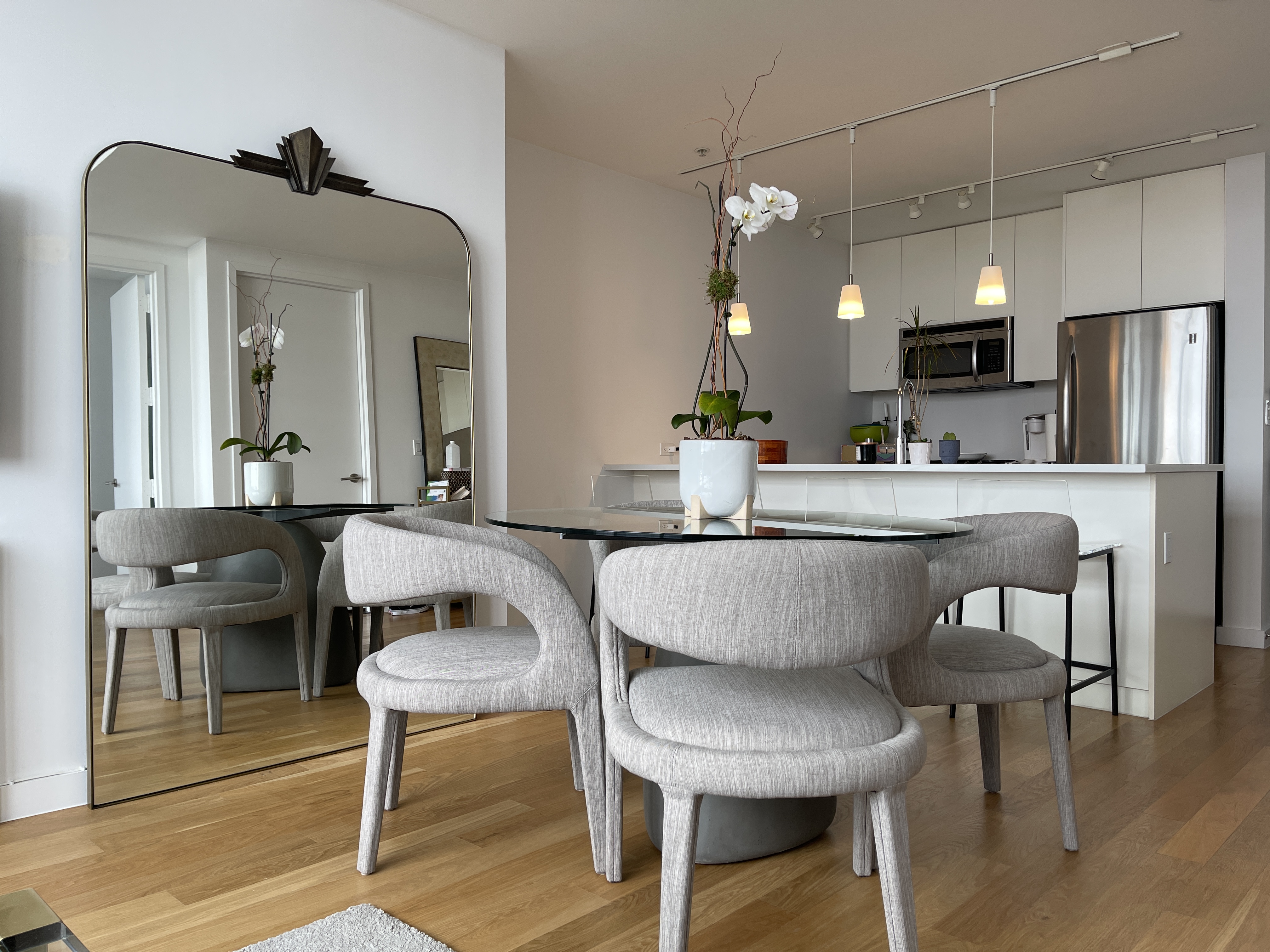 189 Schermerhorn Street, Unit PHC Brooklyn, NY 11201 - Photo 5 of 19 a living room with stainless steel appliances furniture a dining table and chairs
