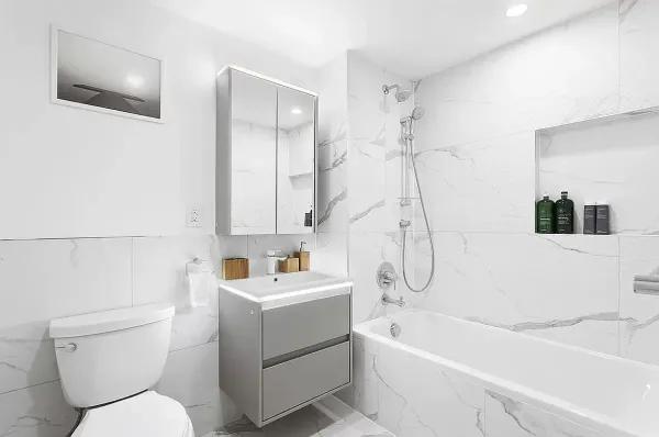a bathroom with a sink a toilet and a bathtub