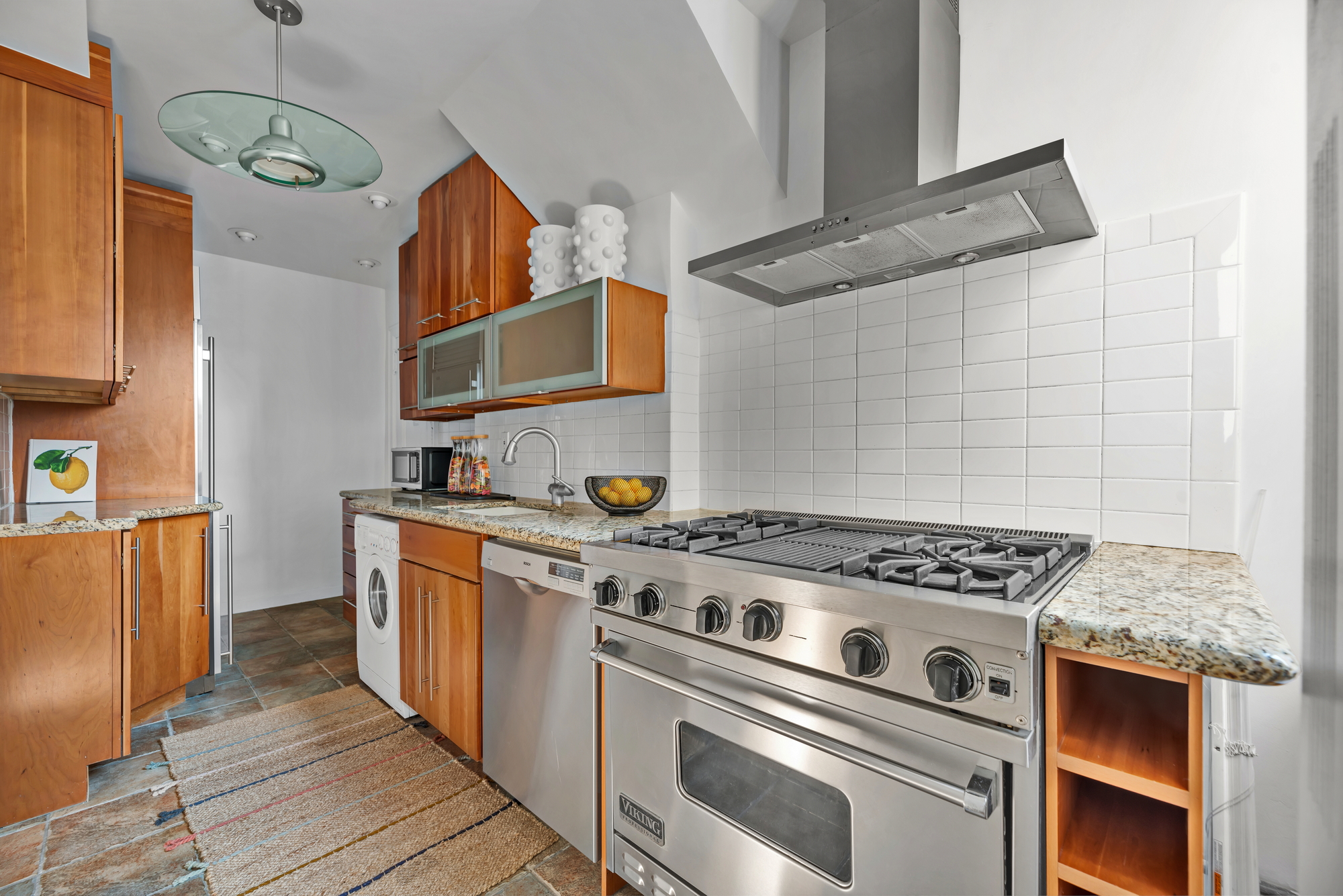 41 West 96th Street, Unit 15D Manhattan, NY 10025 - Photo 3 of 13 a kitchen with stainless steel appliances granite countertop a stove and a sink