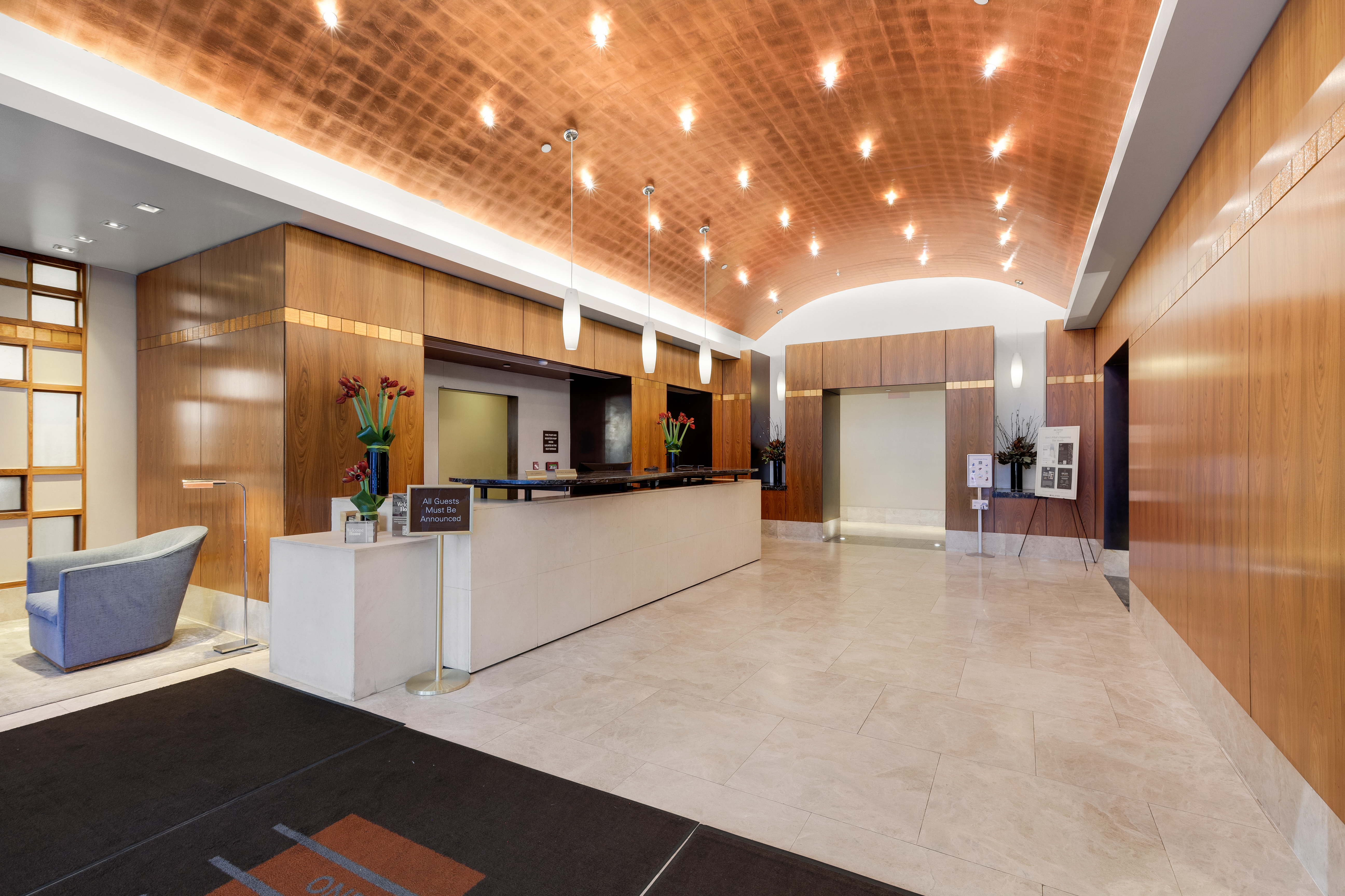 215-217 East 96th Street, Unit 25K Manhattan, NY 10128 - Photo 12 of 16 a view of a living room and kitchen with furniture appliances