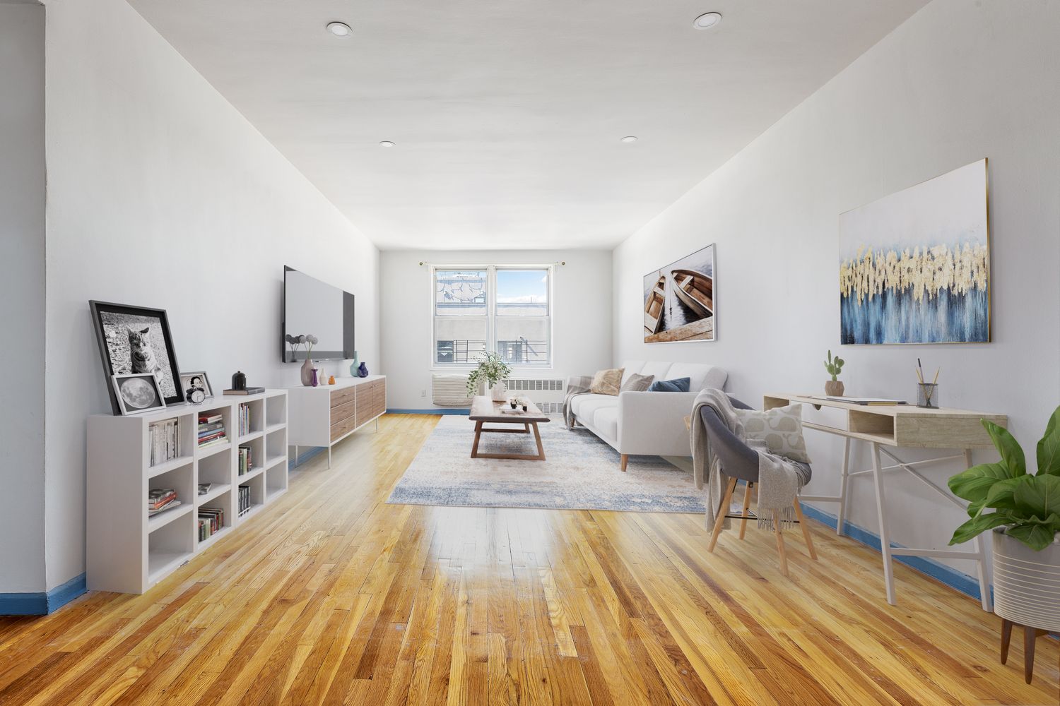 a living room with furniture and a wooden floor