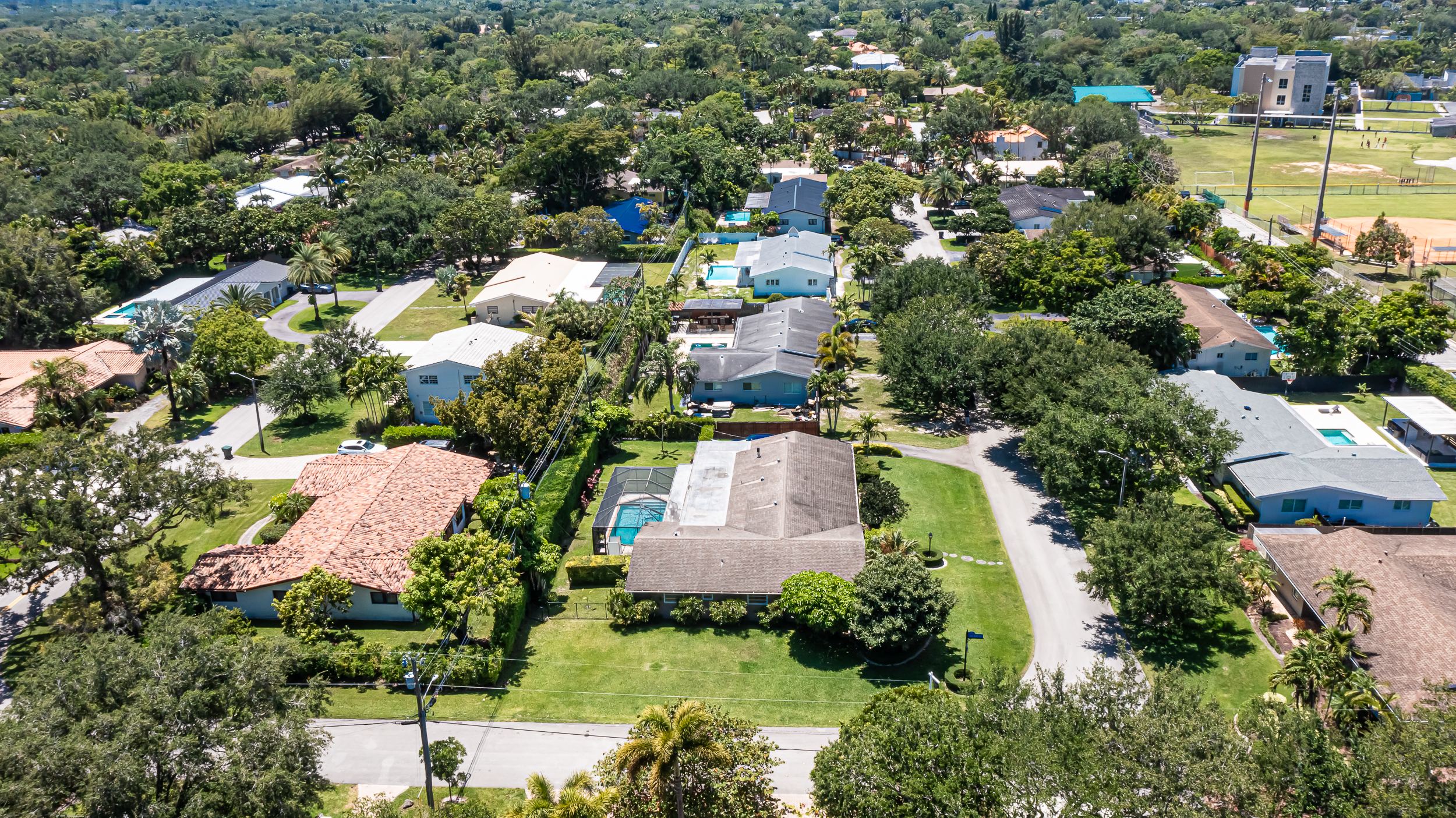 6760 Southwest 62nd Terrace Miami, FL 33143 - Photo 2 of 38 an aerial view of residential houses with outdoor space and swimming pool