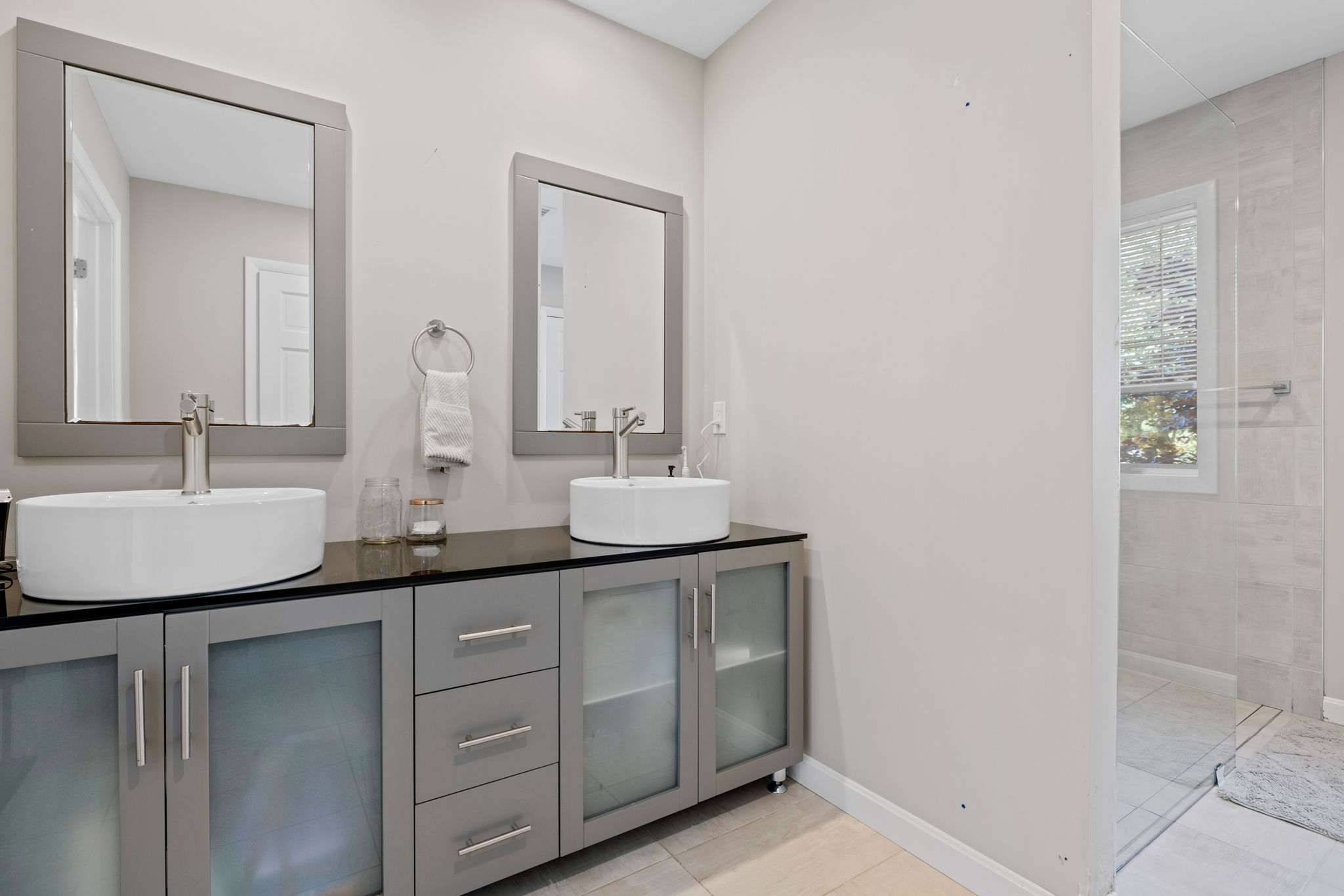 33 Thoreau Circle Beverly, MA 01915 - Photo 13 of 20 a bathroom with a double vanity sink and a mirror
