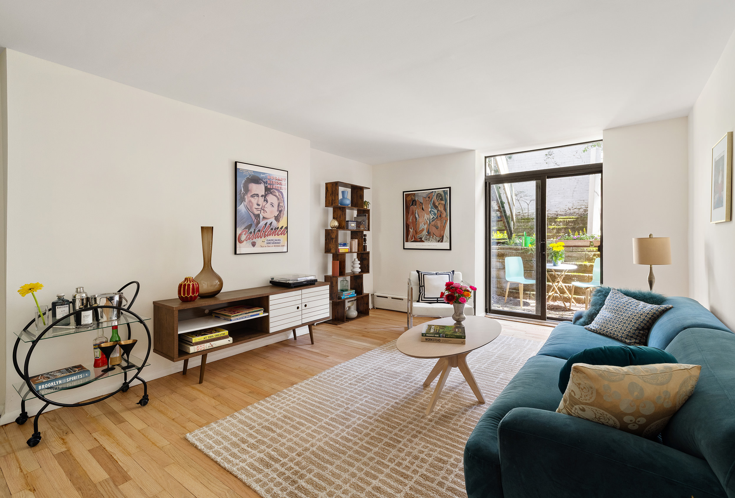 195 Garfield Place, Unit 1L Brooklyn, NY 11215 - Photo 2 of 17 a living room with furniture a rug and a large window