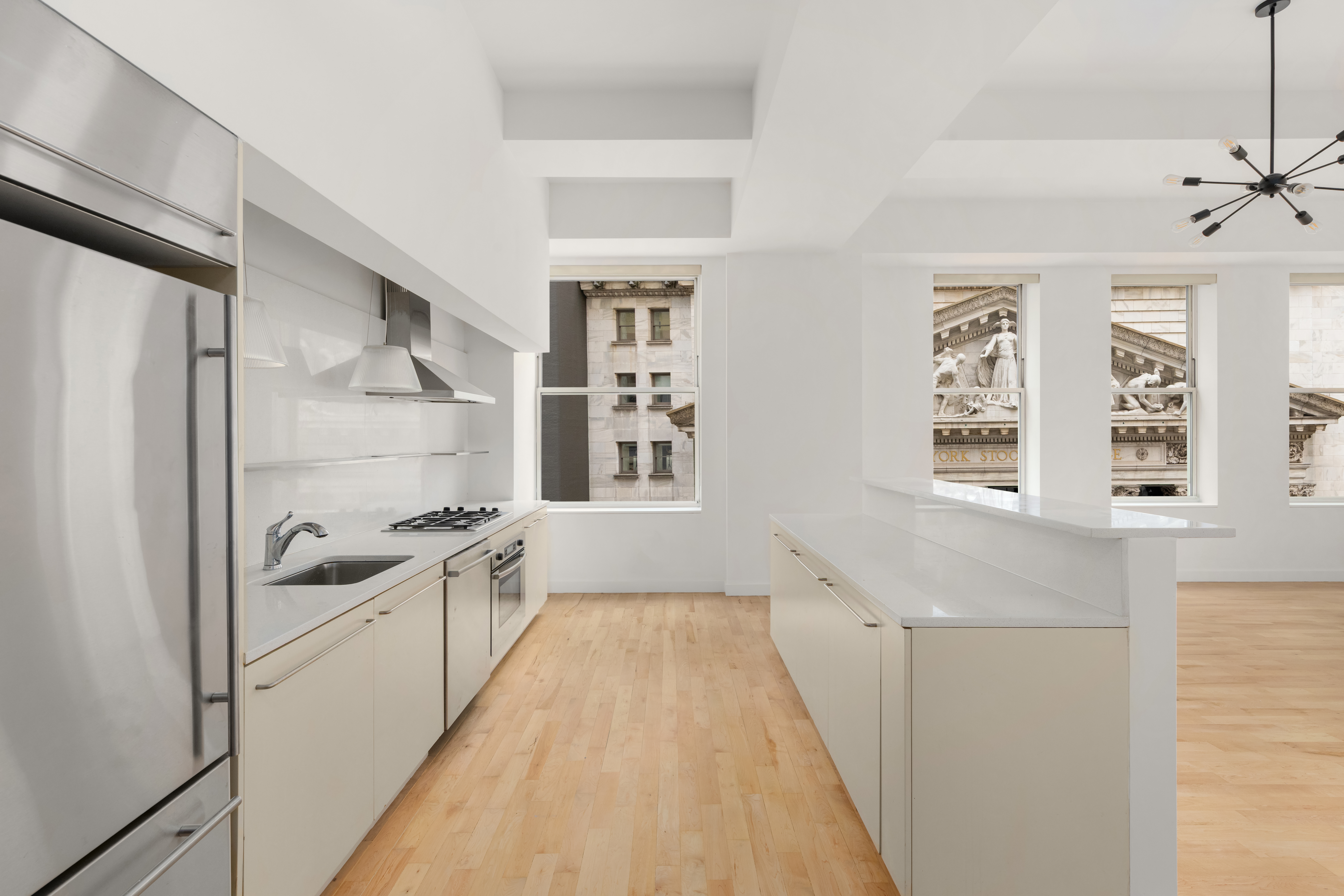 15 Broad Street, Unit 710 Manhattan, NY 10005 - Photo 2 of 11 a room with a sink and appliances