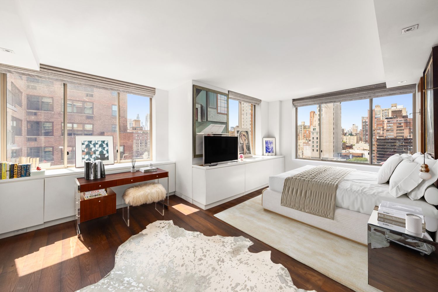 a bedroom with a bed and large windows