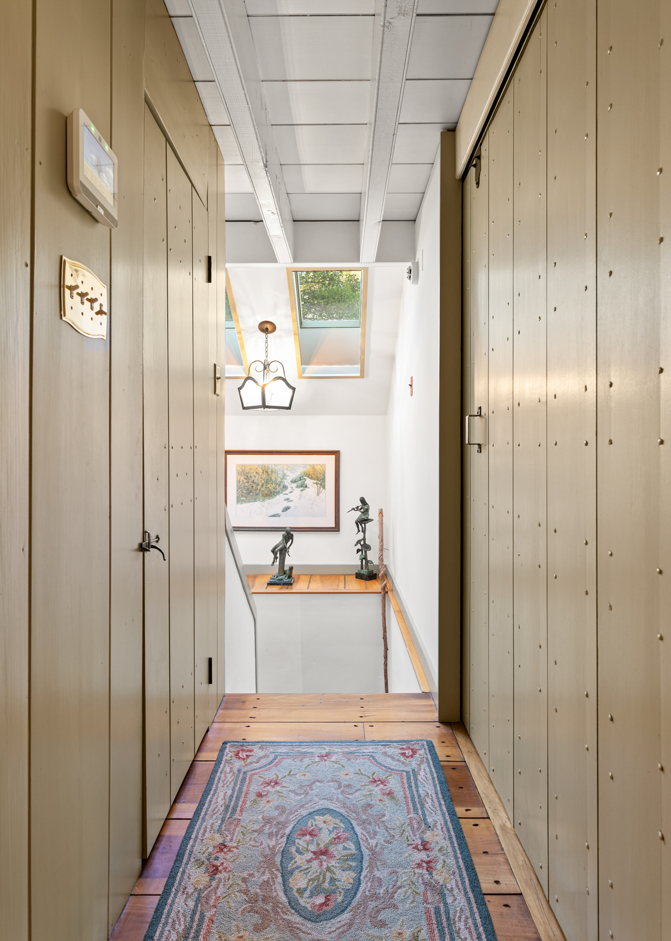 791 Grubbs Mill Road Berwyn, PA 19312 - Photo 8 of 76 a view of a hallway with bathroom and wooden floor