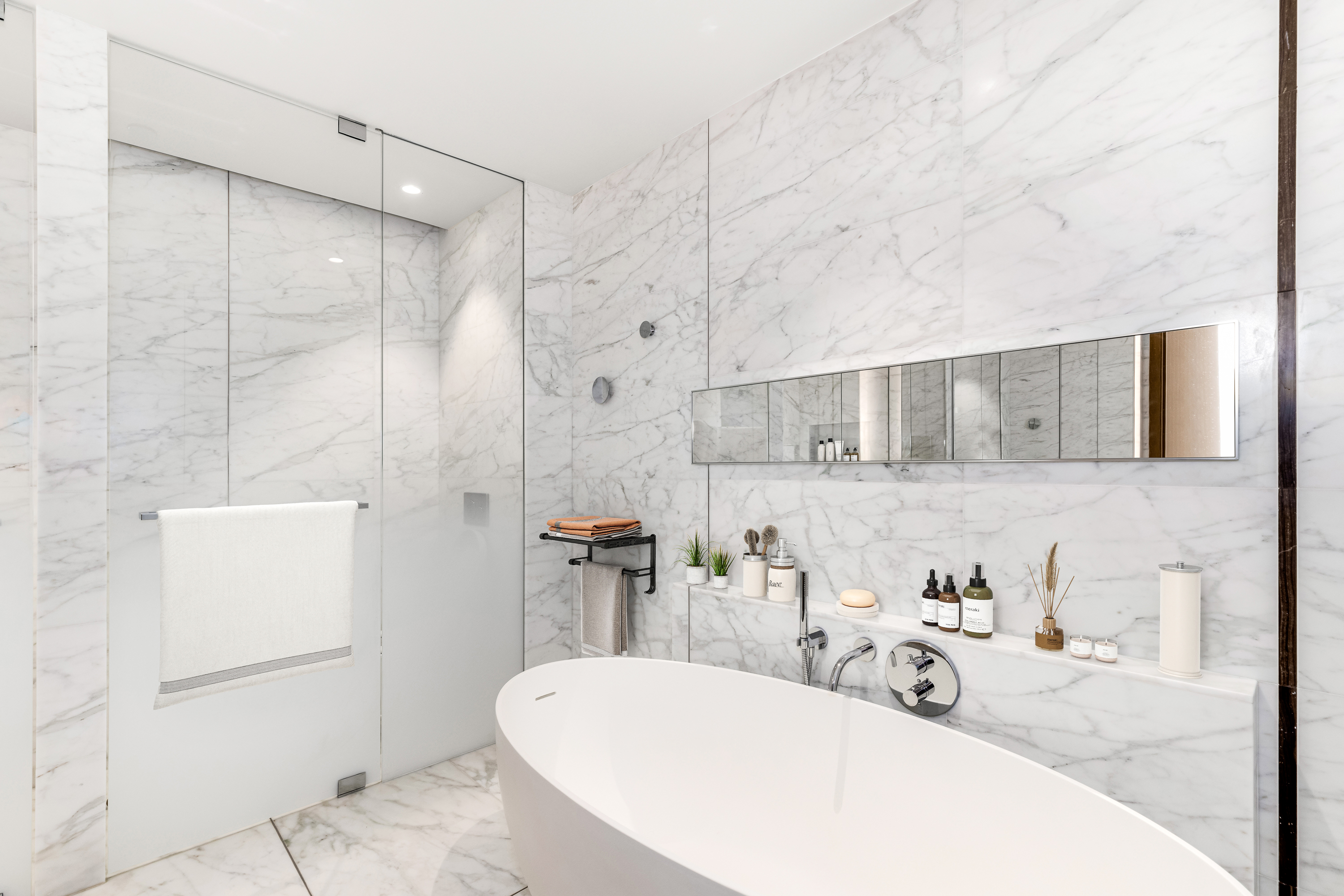 565 Broome Street, Unit S9A Manhattan, NY 10013 - Photo 7 of 19 a bathroom with a tub sink and mirror