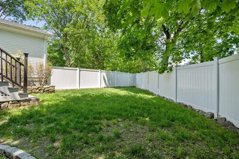 a backyard of a house with seating space
