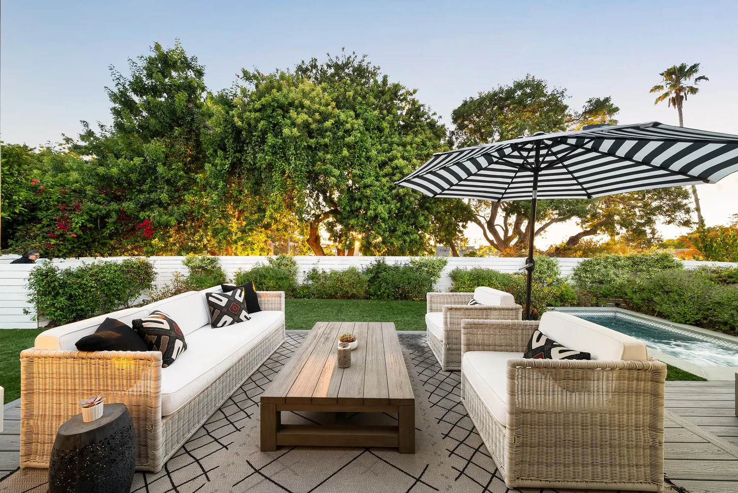 swimming pool view with a seating space