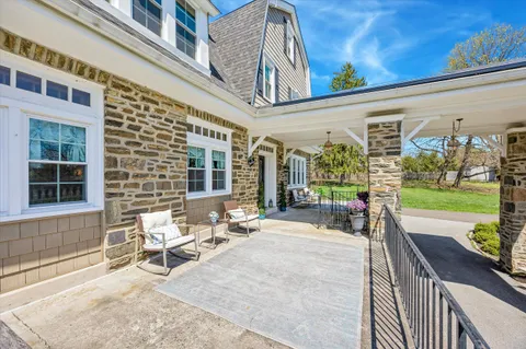 a building outdoor space with patio furniture and garden
