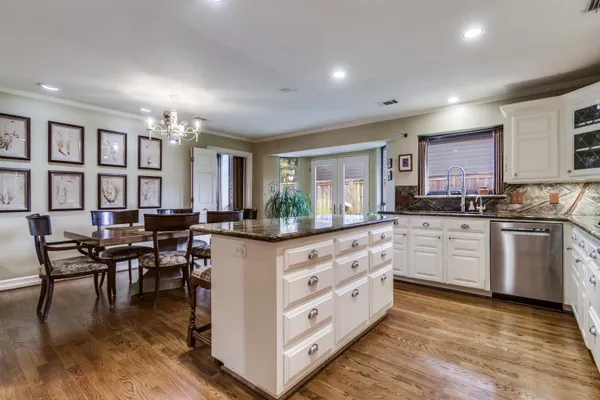 a bedroom with a bed couch and window