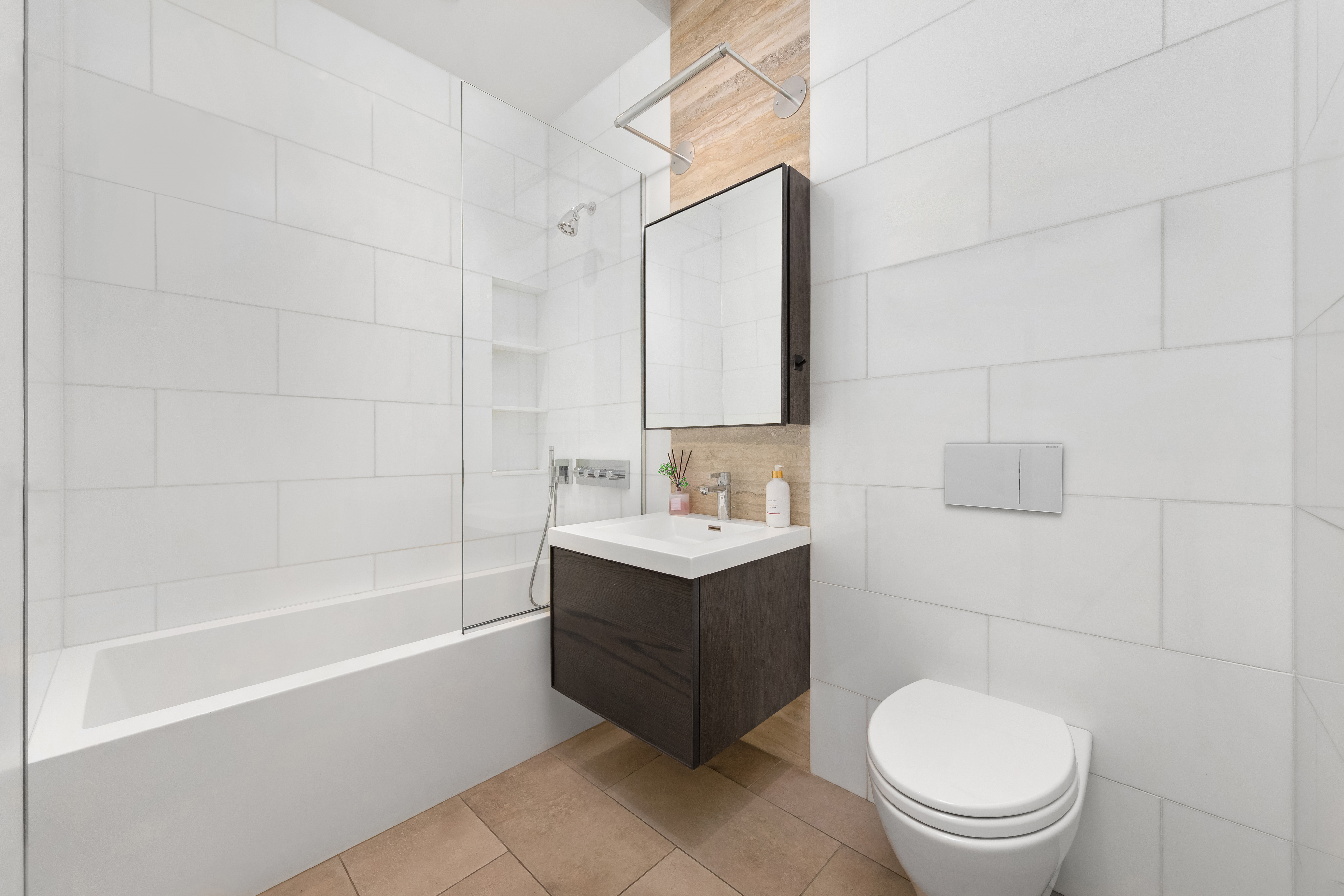 90 Lexington Avenue, Unit MC Manhattan, NY 10016 - Photo 10 of 26 a bathroom with a sink a toilet and a bathtub