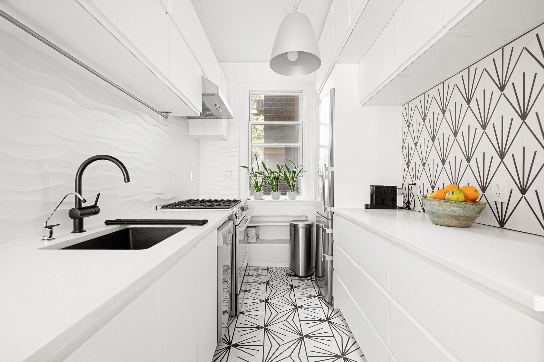 35-55 78th Street, Unit 1 Queens, NY 11372 - Photo 4 of 12 a kitchen with stainless steel appliances a sink a stove and a refrigerator with wooden floor