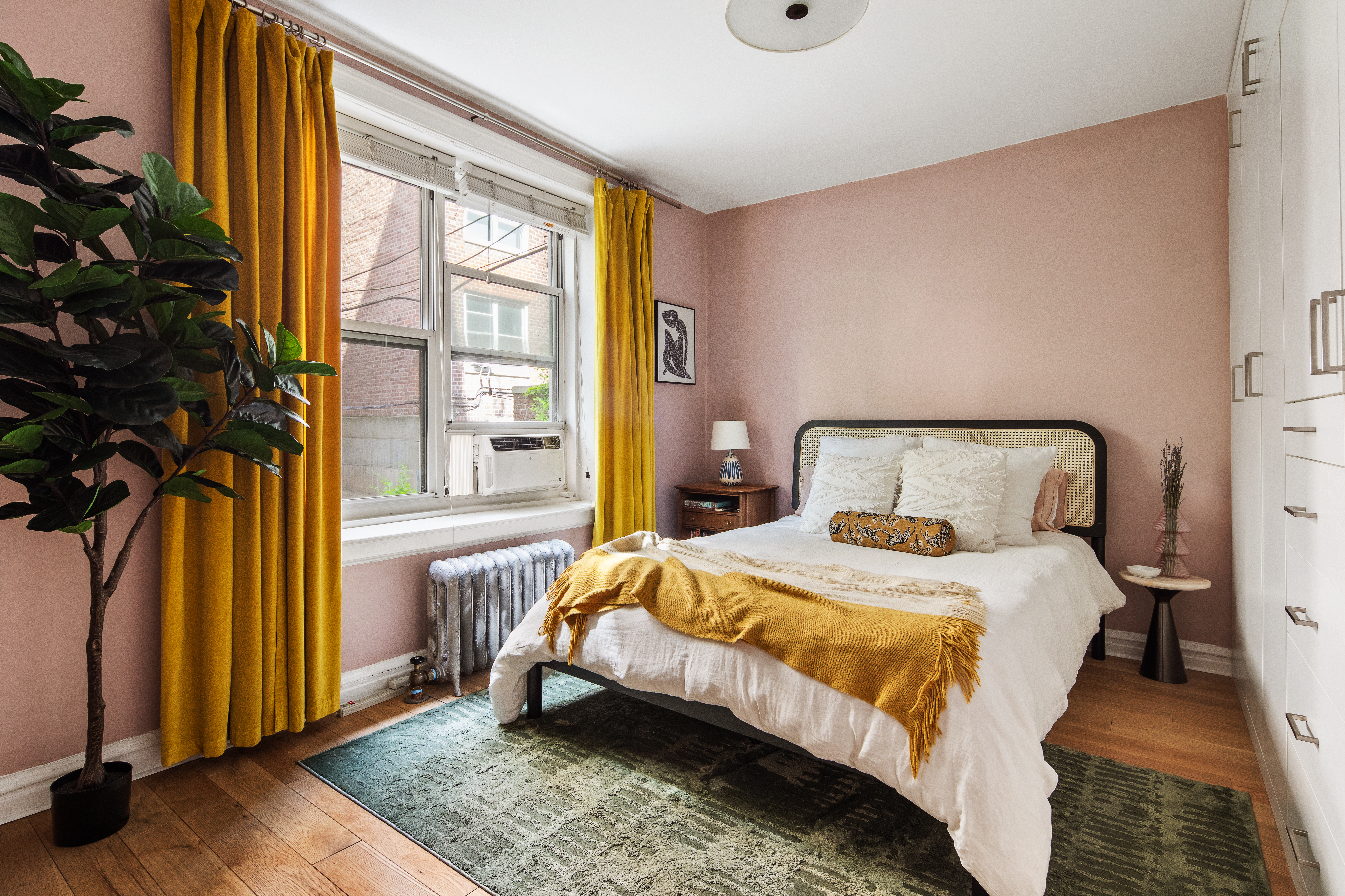 30 Clinton Street, Unit 1E Brooklyn, NY 11201 - Photo 4 of 6 a bedroom with a bed and a window