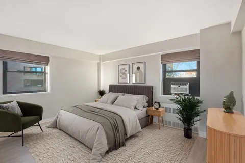 a bedroom with a bed and a couch