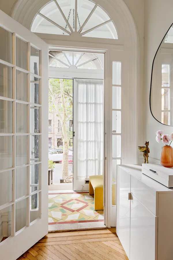 a potted plant sitting in front of a glass door