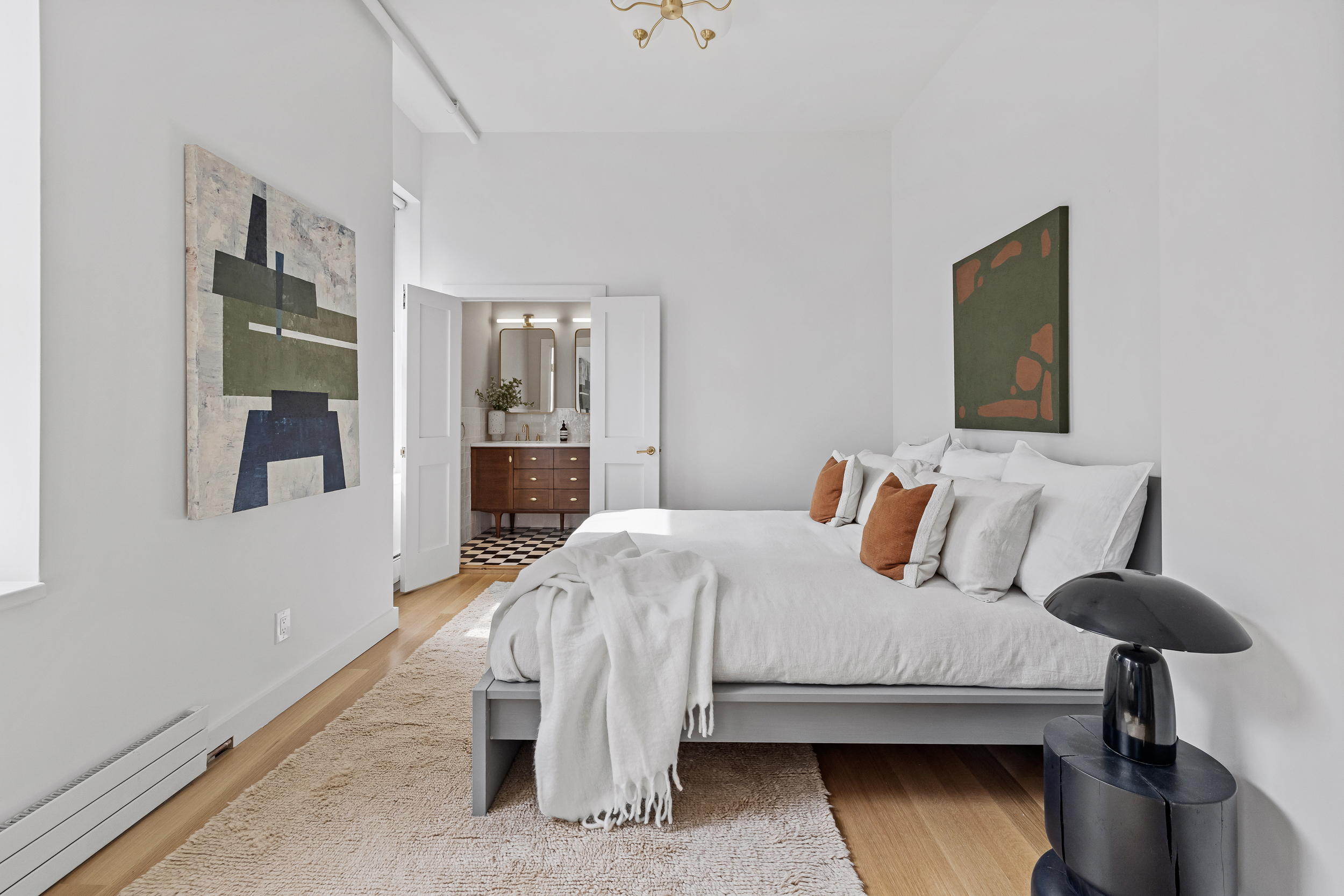 325 Bowery, Unit 3 Manhattan, NY 10003 - Photo 8 of 14 a bedroom with a bed and a table