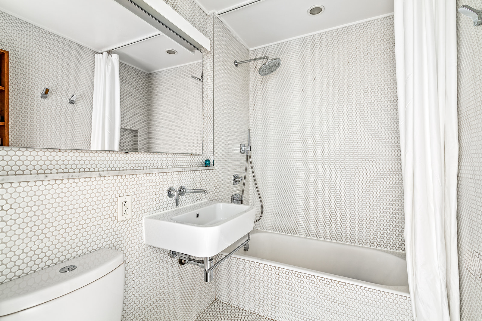 525 Ocean Parkway, Unit 2B Brooklyn, NY 11218 - Photo 10 of 12 a bathroom with a sink toilet and shower