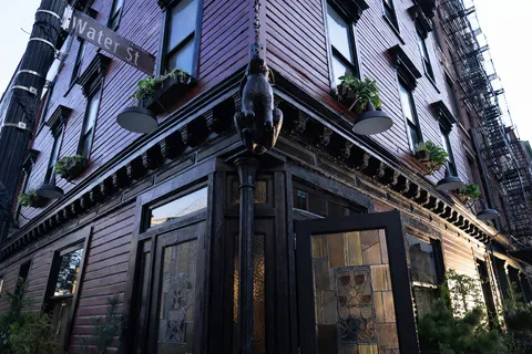 a view of roof with potted plants and ocean view