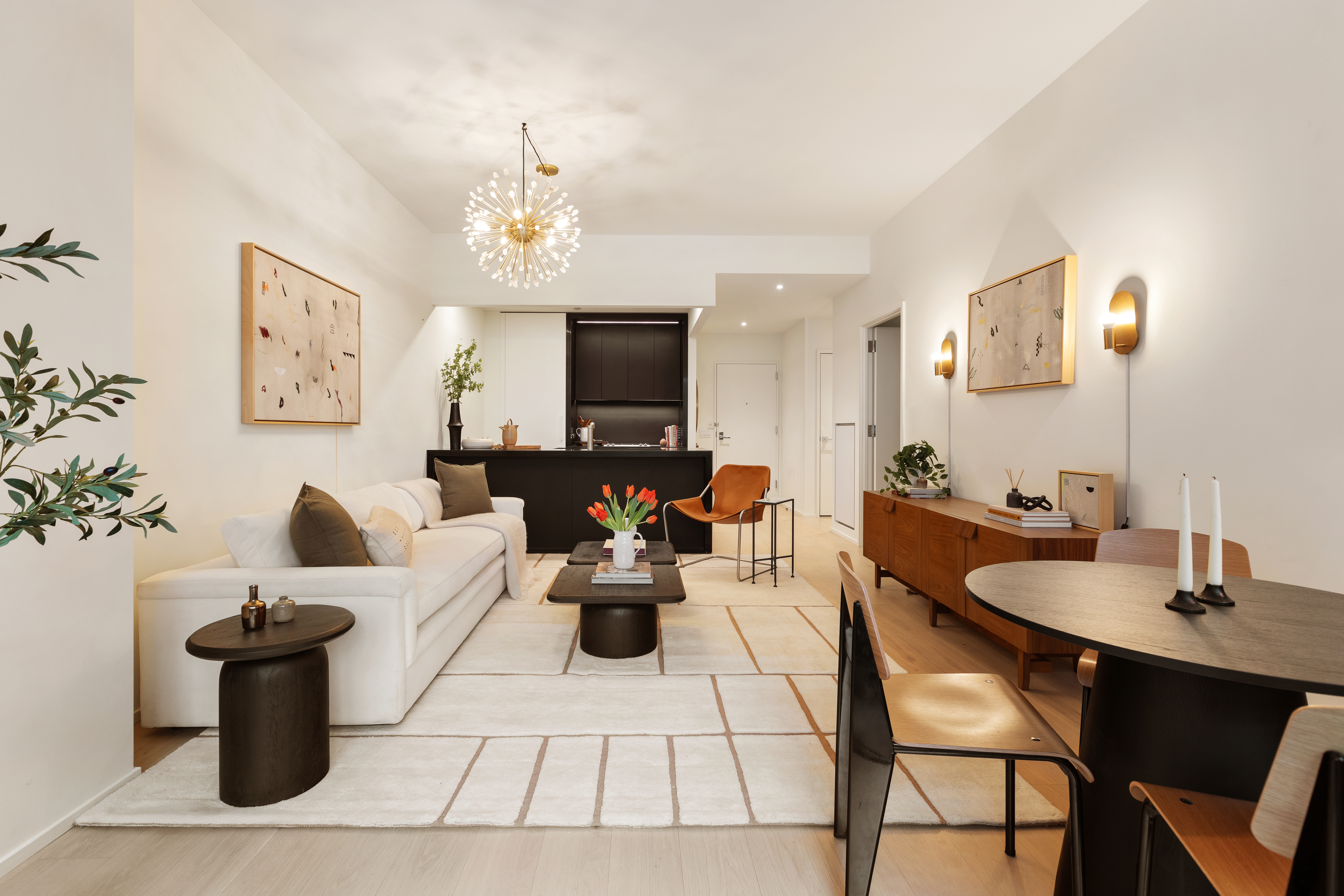 121 East 22nd Street, Unit N501 Manhattan, NY 10010 - Photo 1 of 13 a living room with furniture a fireplace and a chandelier