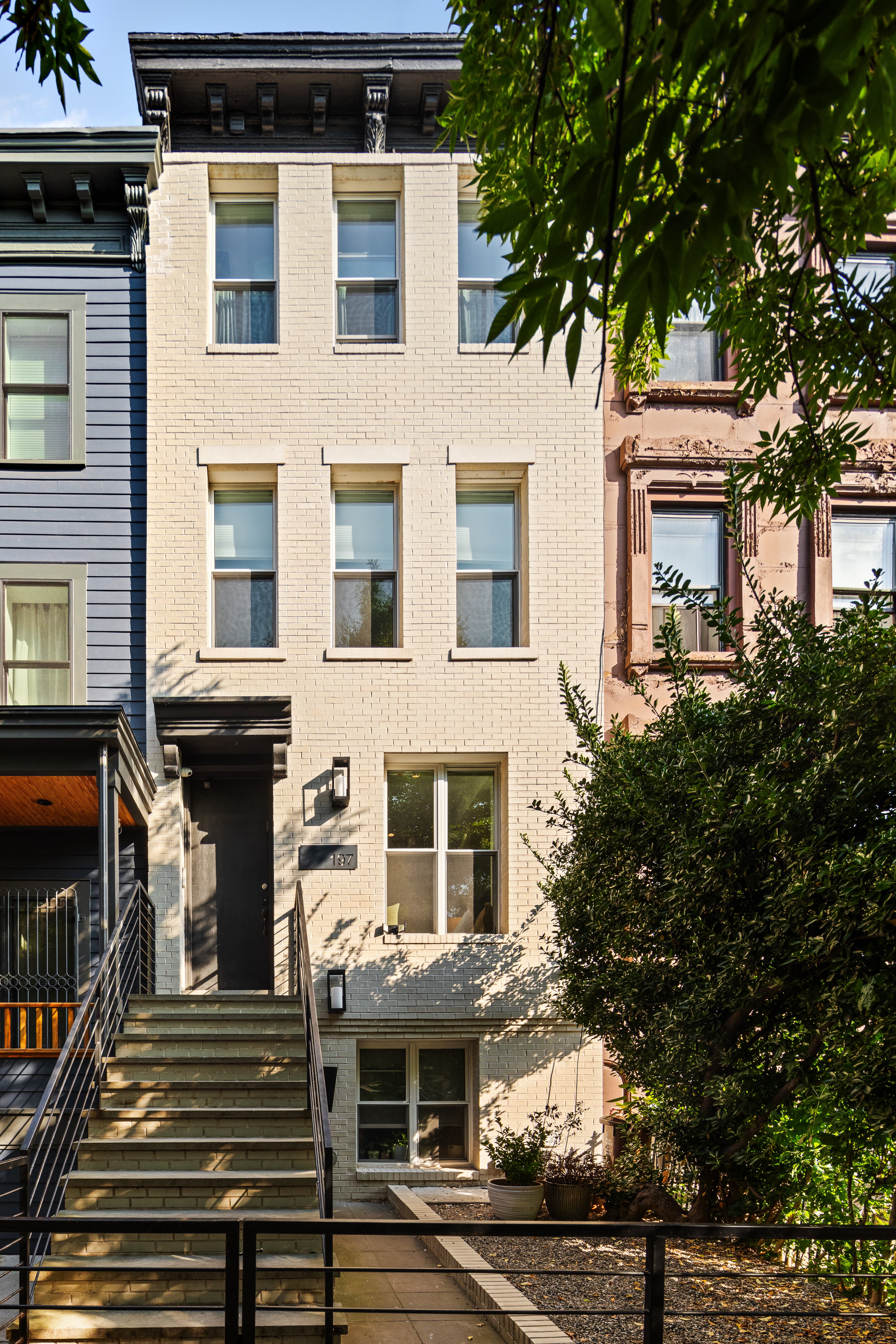 197 Madison Street Brooklyn, NY 11216 - Photo 18 of 19 a front view of a house with a tree