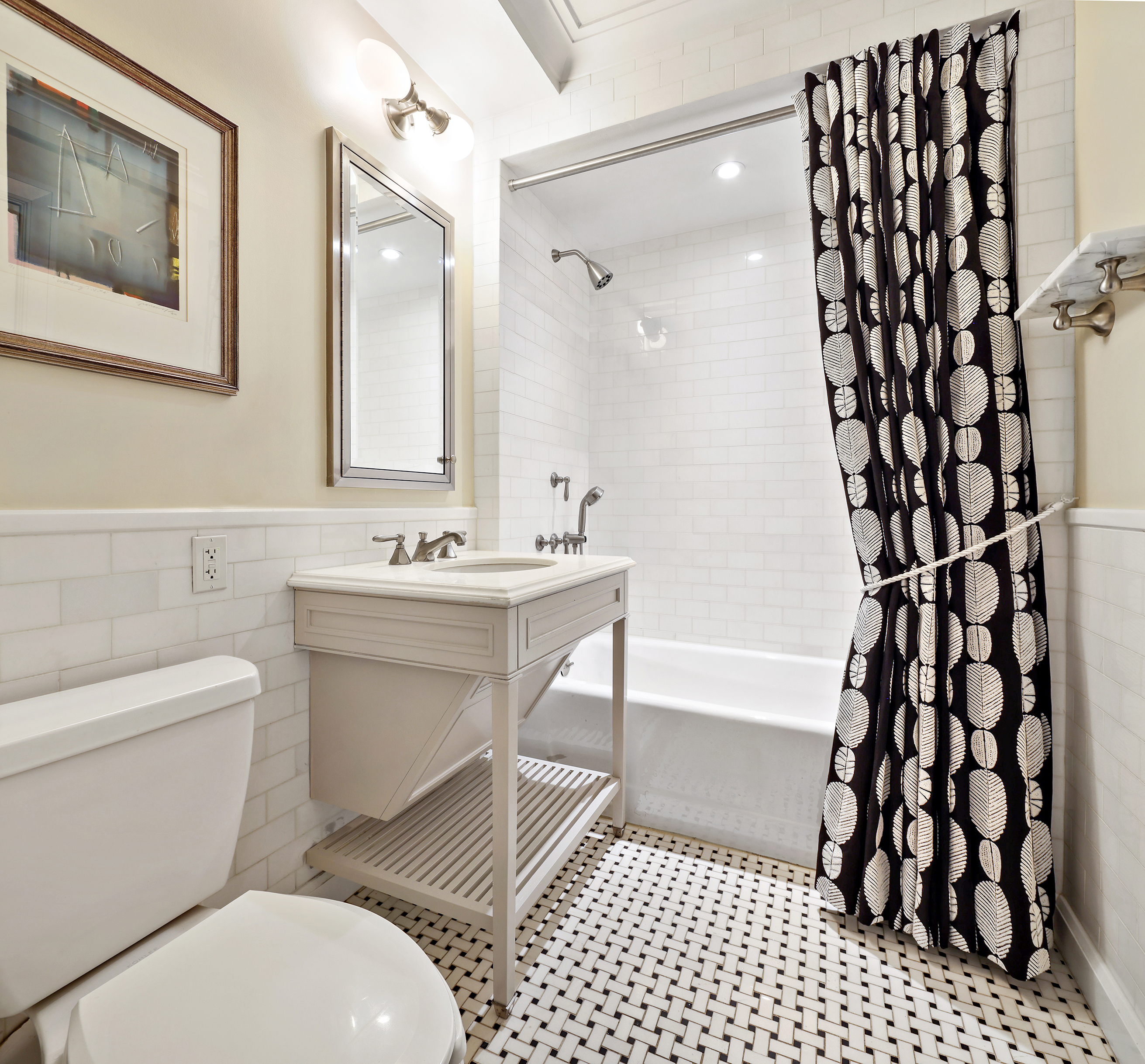 530 Park Avenue, Unit 10D Manhattan, NY 10065 - Photo 10 of 13 a bathroom with a sink a toilet and shower