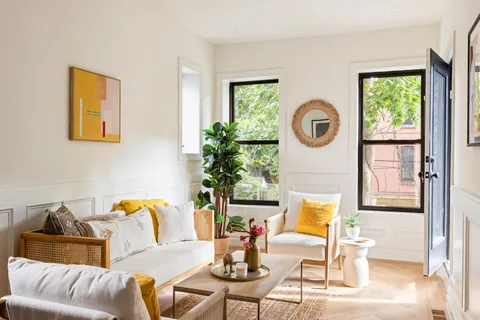 a living room with furniture and a window