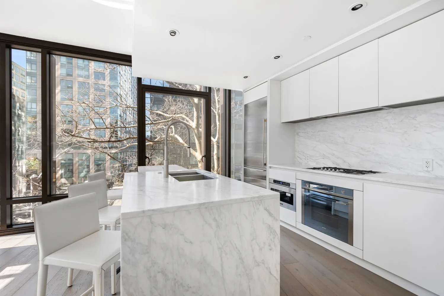 a kitchen with a stove a sink and a refrigerator