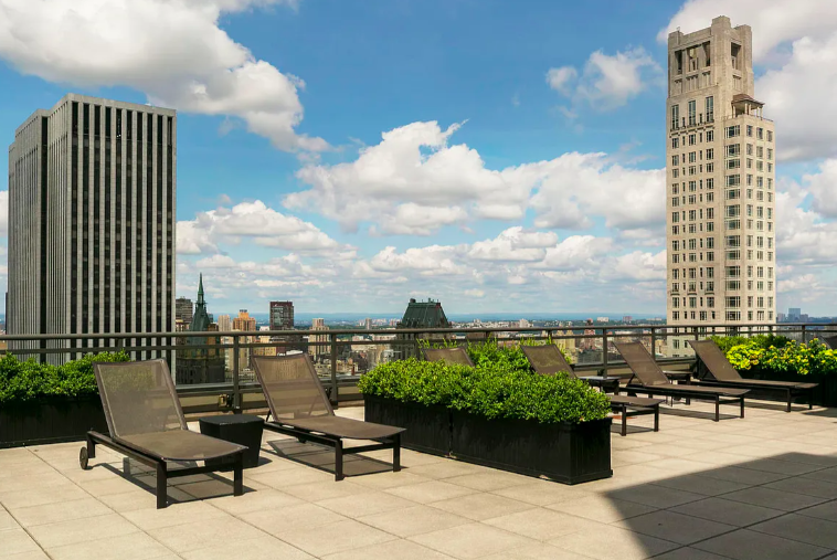 117 East 57th Street, Unit 35D Manhattan, NY 10022 - Photo 23 of 30 a view of balcony with outdoor seating and city view