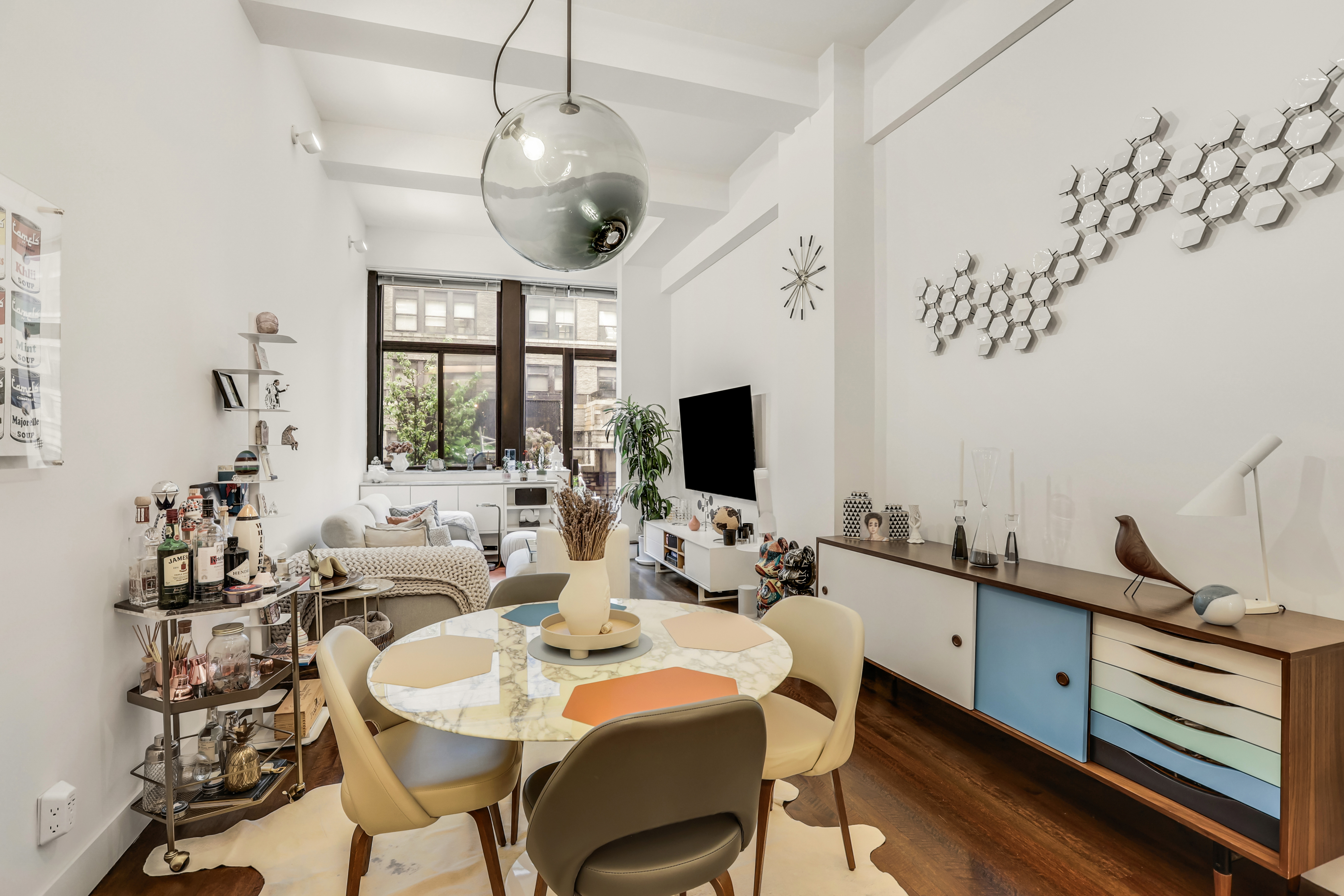 310 East 46th Street, Unit 10S Manhattan, NY 10017 - Photo 4 of 10 a view of a dining room with furniture window and outside view