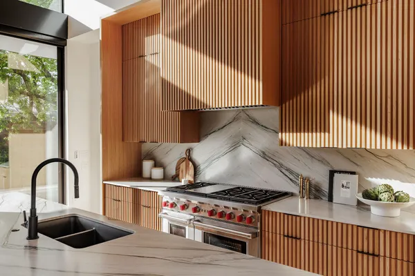 a dining room with furniture a flat screen tv and a large window