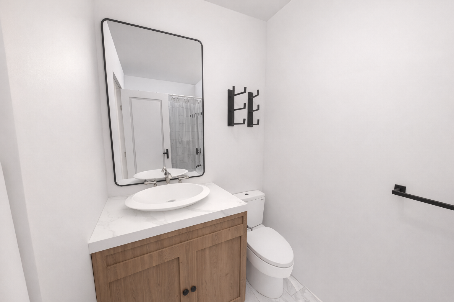 21 Monroe Place, Unit 5FR Brooklyn, NY 11201 - Photo 13 of 16 a bathroom with a granite countertop toilet a sink and a mirror