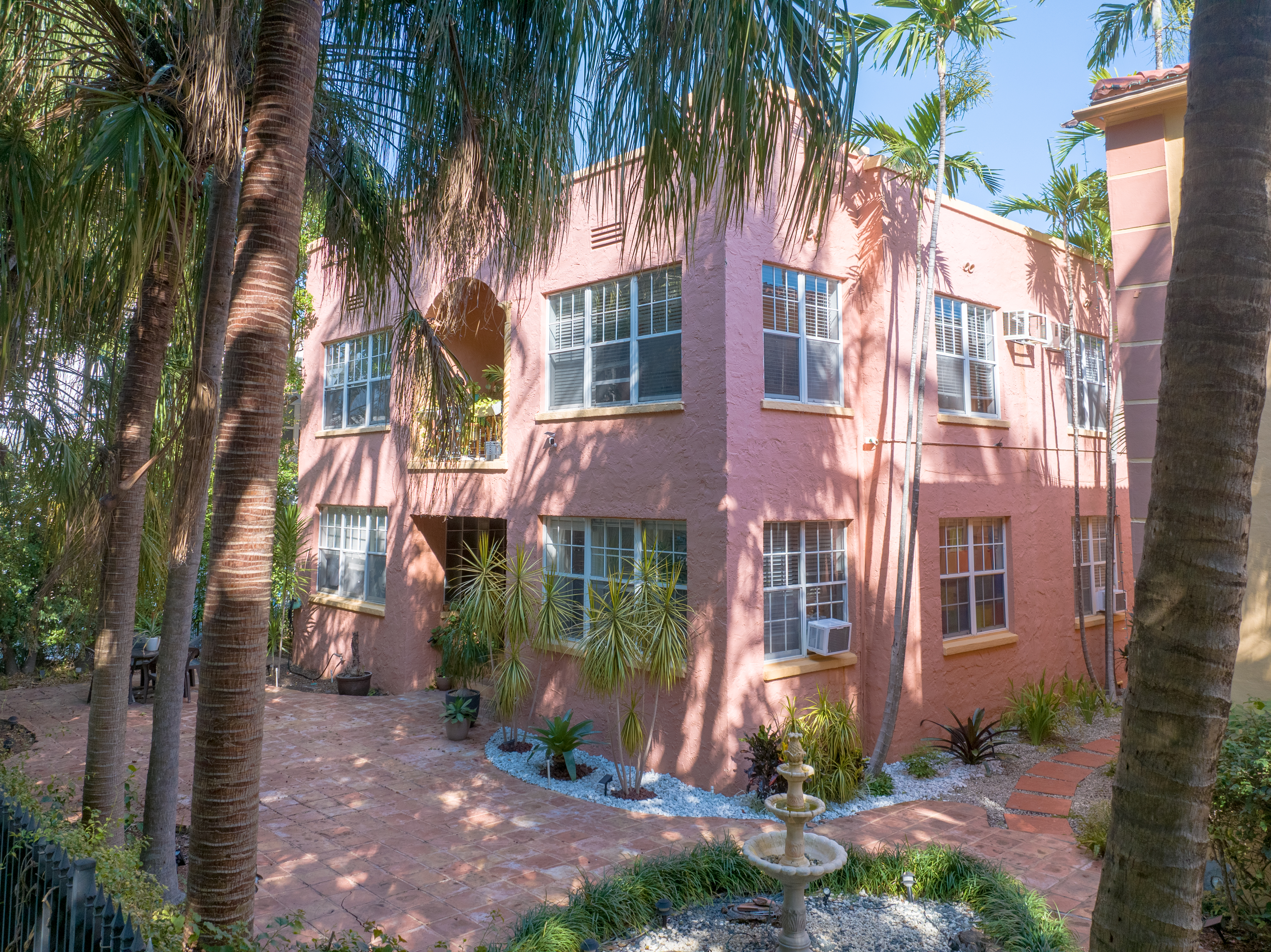 735-745 Meridian Avenue Miami Beach, FL 33139 - Photo 56 of 62 a front view of a multi story building with yard