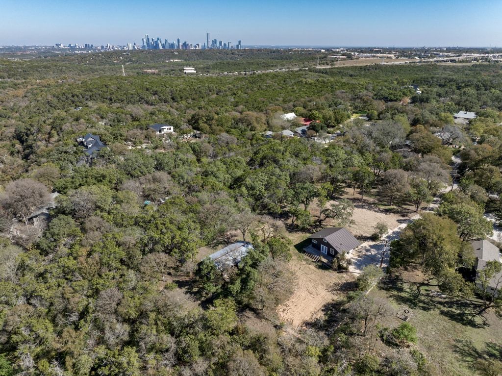 4416 Stearn's Lane Austin, TX 78735 - Photo 12 of 32 an aerial view of residential houses with outdoor space and trees